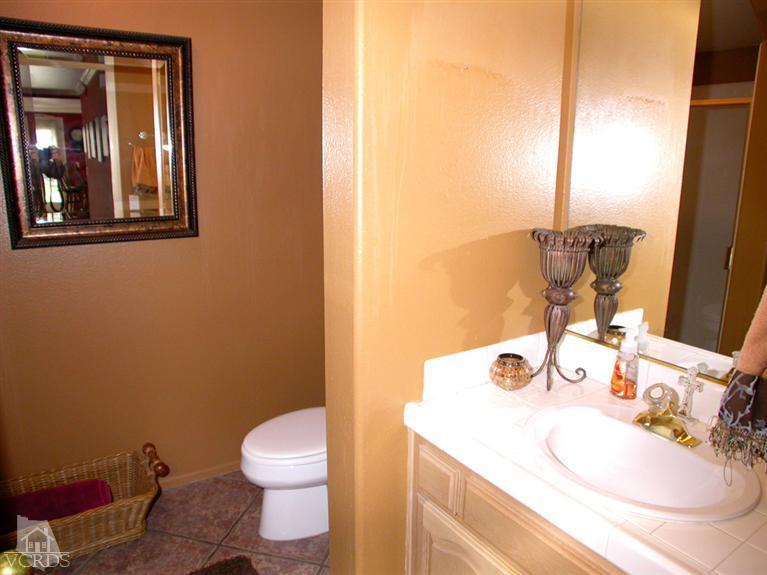321 Fresh Meadows Road Simi Valley, CA 93065 - Photo 6 of 23 a bathroom with a sink vanity mirror and toilet