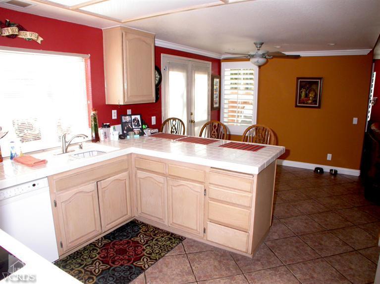 321 Fresh Meadows Road Simi Valley, CA 93065 - Photo 8 of 23 a kitchen with a sink cabinets and window