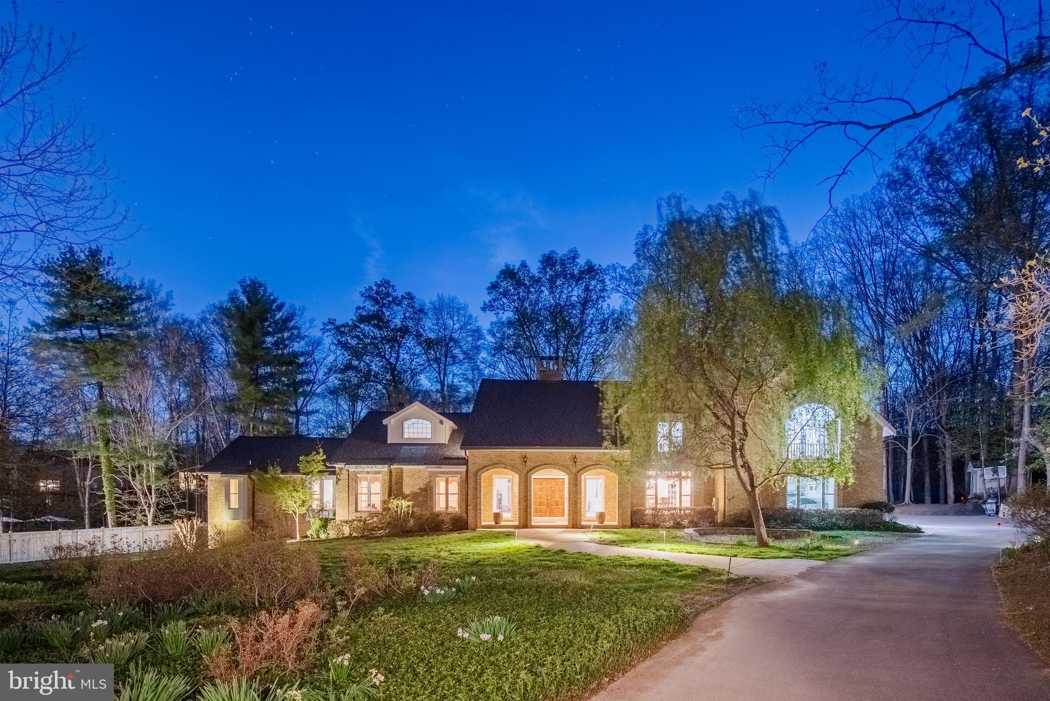 10100 Iron Gate Road Potomac, MD 20854 - Photo 1 of 16 a front view of a house with a yard