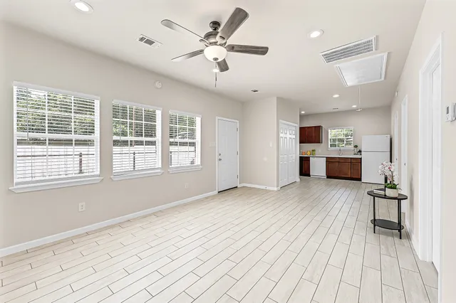 a view of a livingroom with a kitchen