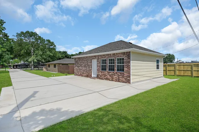 a view of a backyard of the house