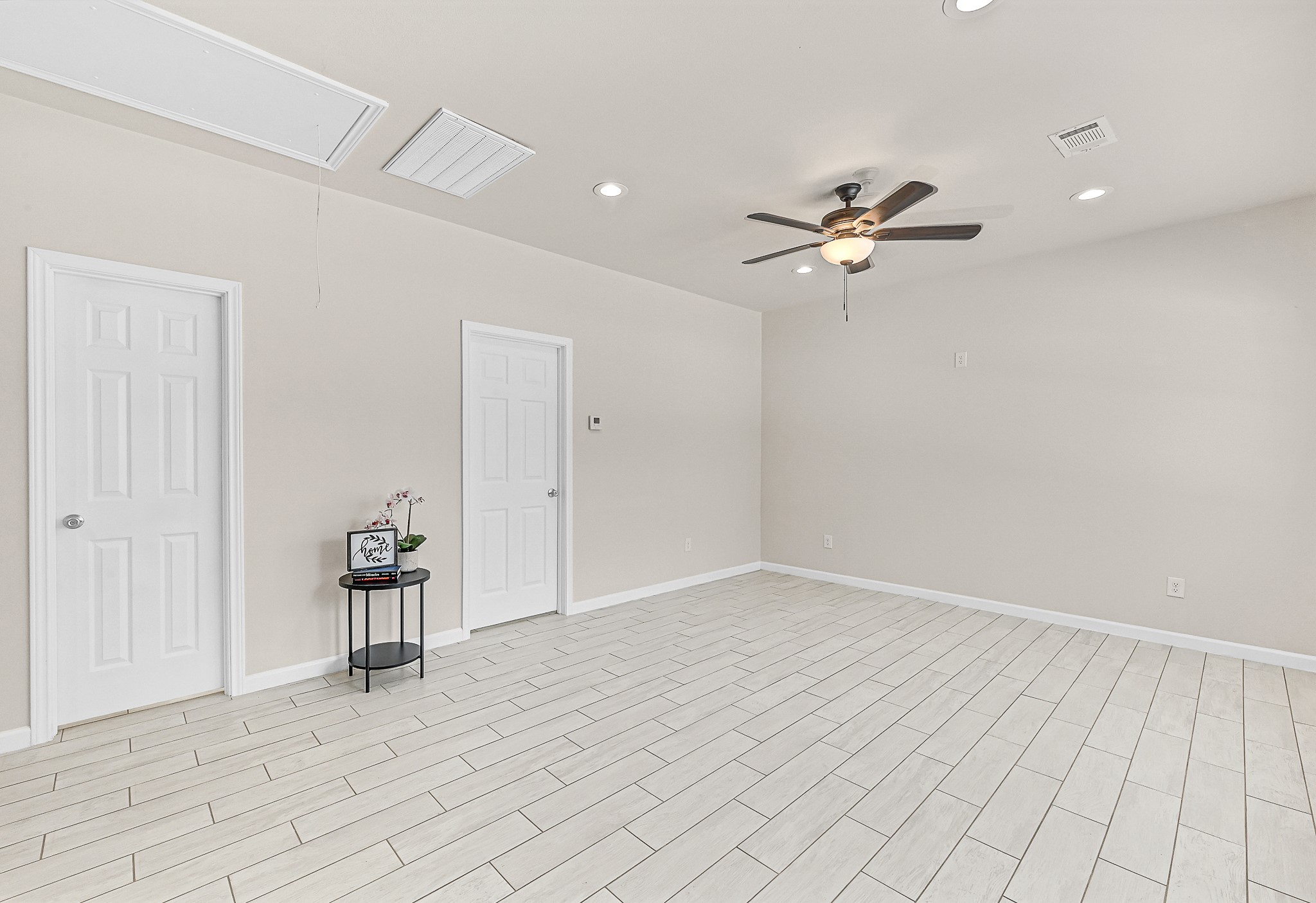 20603 Marilyn Lane, Unit B Spring, TX 77388 - Photo 6 of 18 wooden floor in an empty room with a window