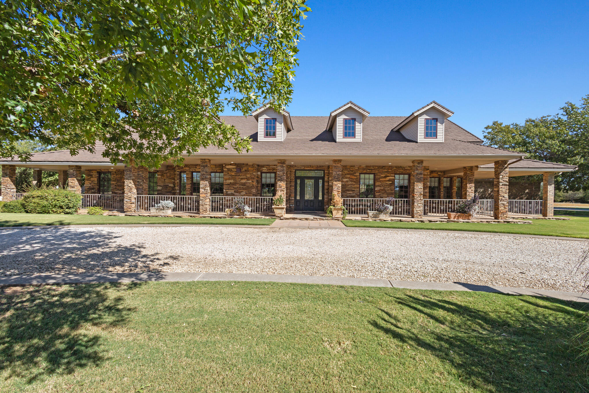 7002 50th Street Lubbock, TX 79407 - Photo 11 of 81 a front view of a residential houses with yard and green space