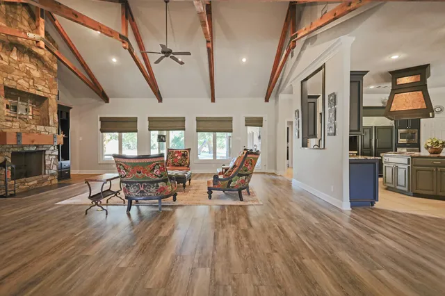 a kitchen with furniture and a fireplace
