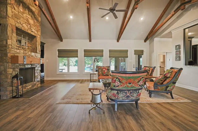 a kitchen with stainless steel appliances granite countertop a sink and a stove