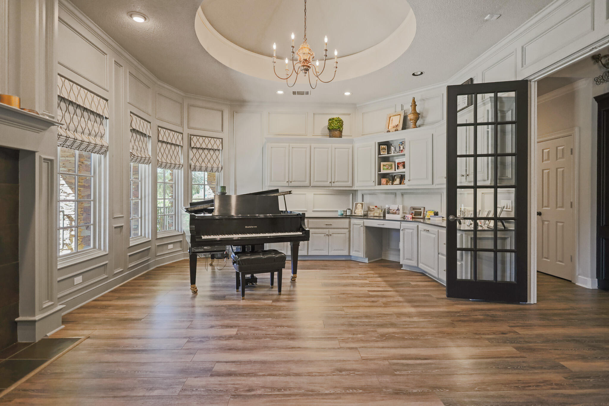 7002 50th Street Lubbock, TX 79407 - Photo 18 of 81 a kitchen with stainless steel appliances granite countertop a stove top oven a sink dishwasher a dining table and chairs with wooden floor