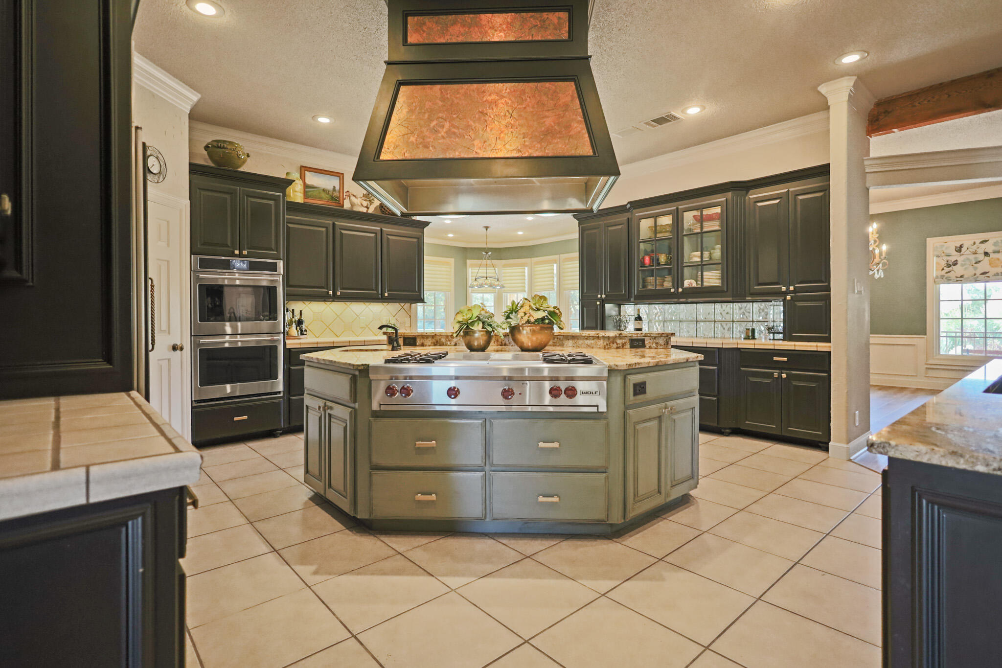 7002 50th Street Lubbock, TX 79407 - Photo 23 of 81 a kitchen with stainless steel appliances kitchen island granite countertop a sink counter space and a window