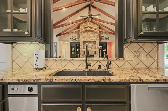 a spacious bedroom with a bed and glass door