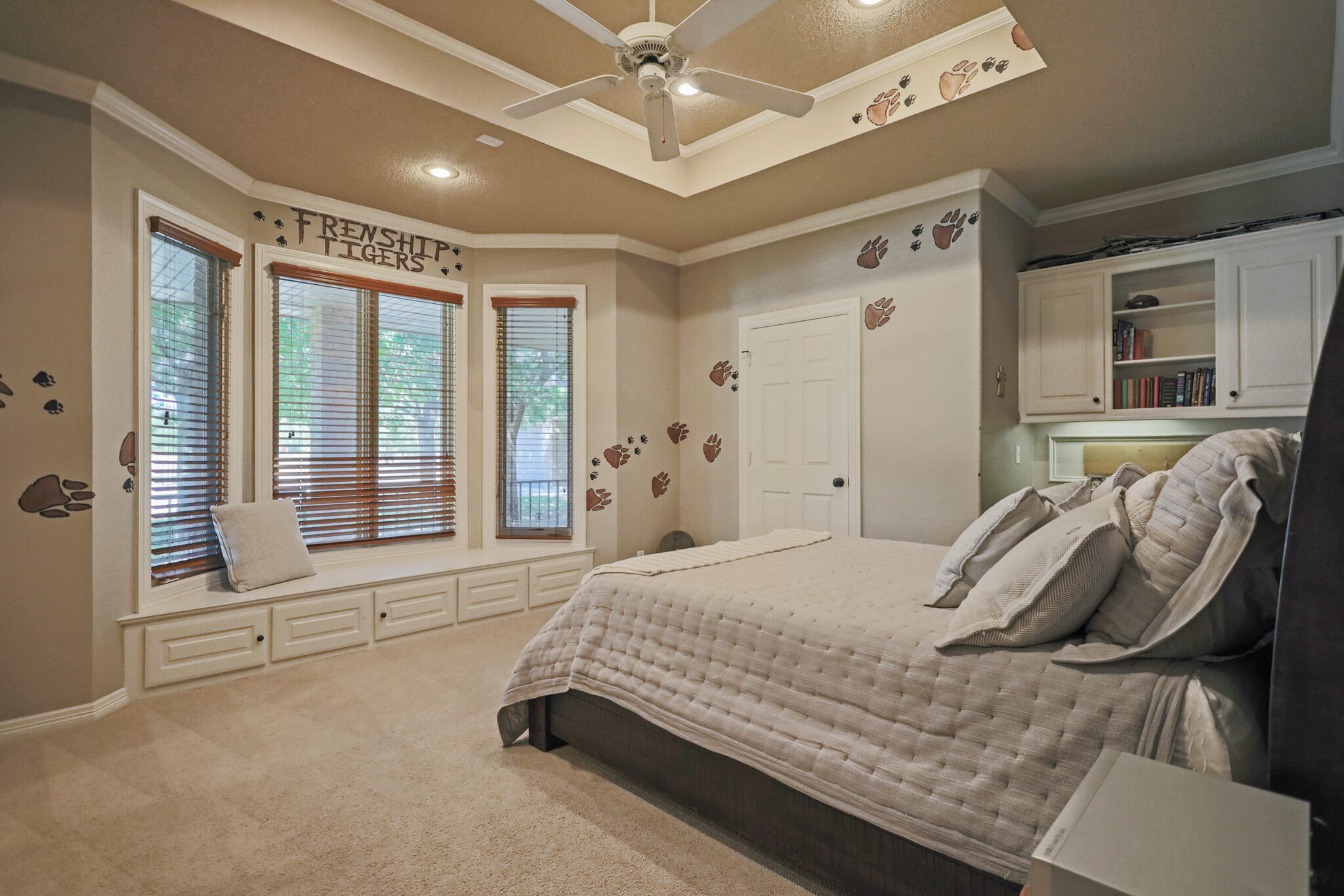 7002 50th Street Lubbock, TX 79407 - Photo 33 of 81 a spacious bedroom with a bed and glass door