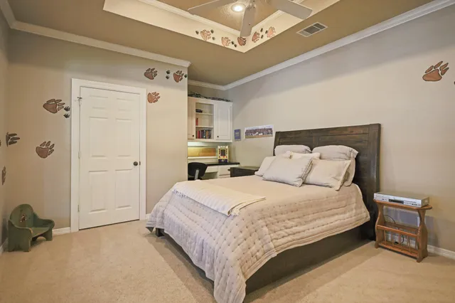 a kitchen with kitchen island granite countertop a sink cabinets and wooden floor