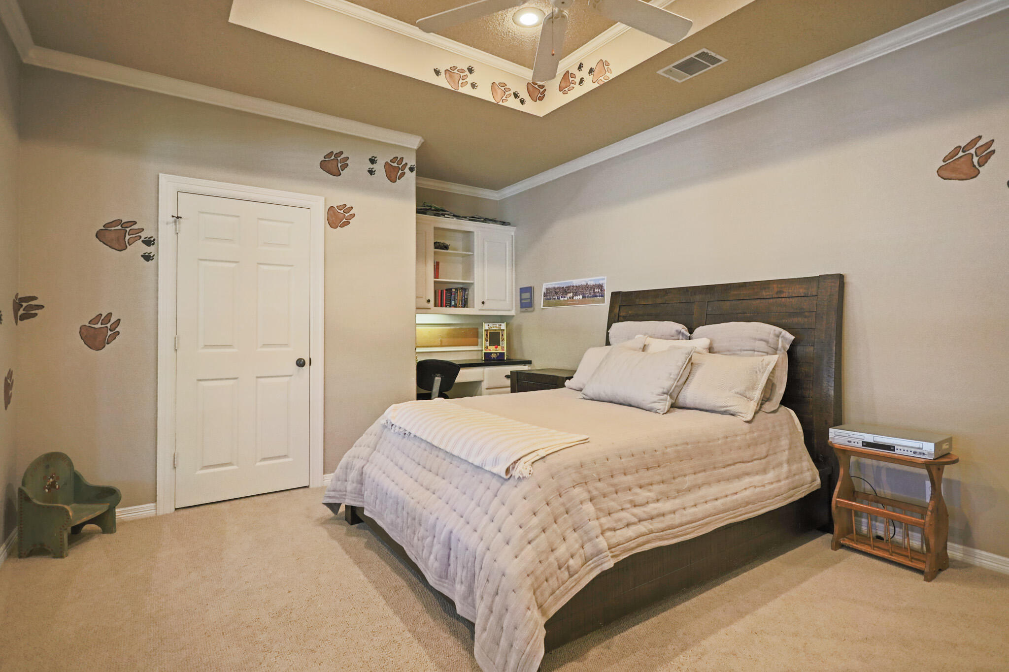 7002 50th Street Lubbock, TX 79407 - Photo 34 of 81 a bedroom with a bed and a cabinets