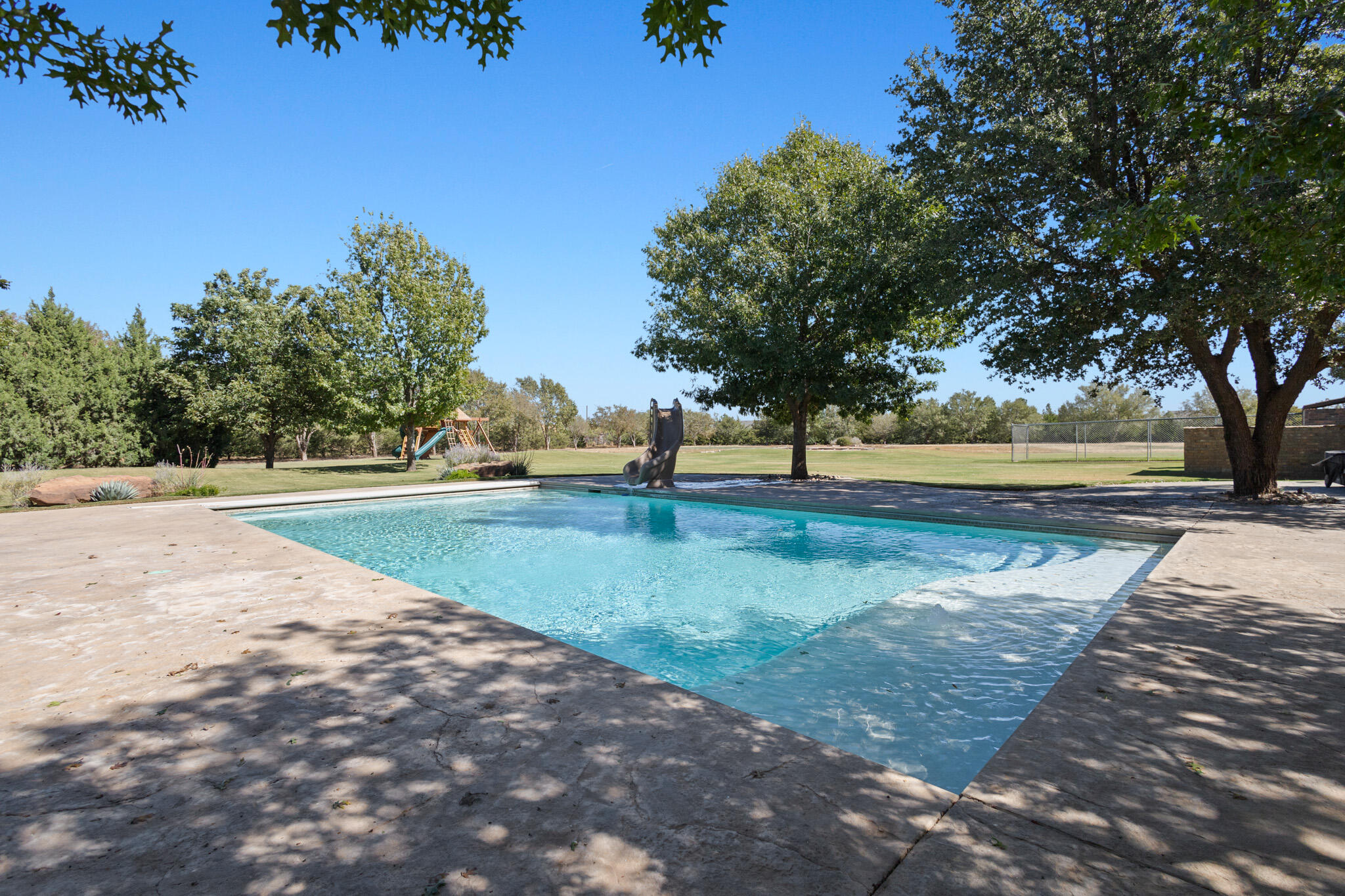 7002 50th Street Lubbock, TX 79407 - Photo 49 of 81 a view of dirt yard with large trees