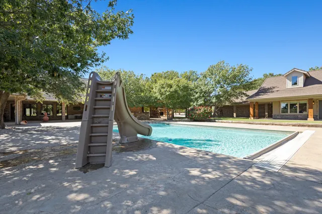a white toilet sitting next to a bath tub and a shower