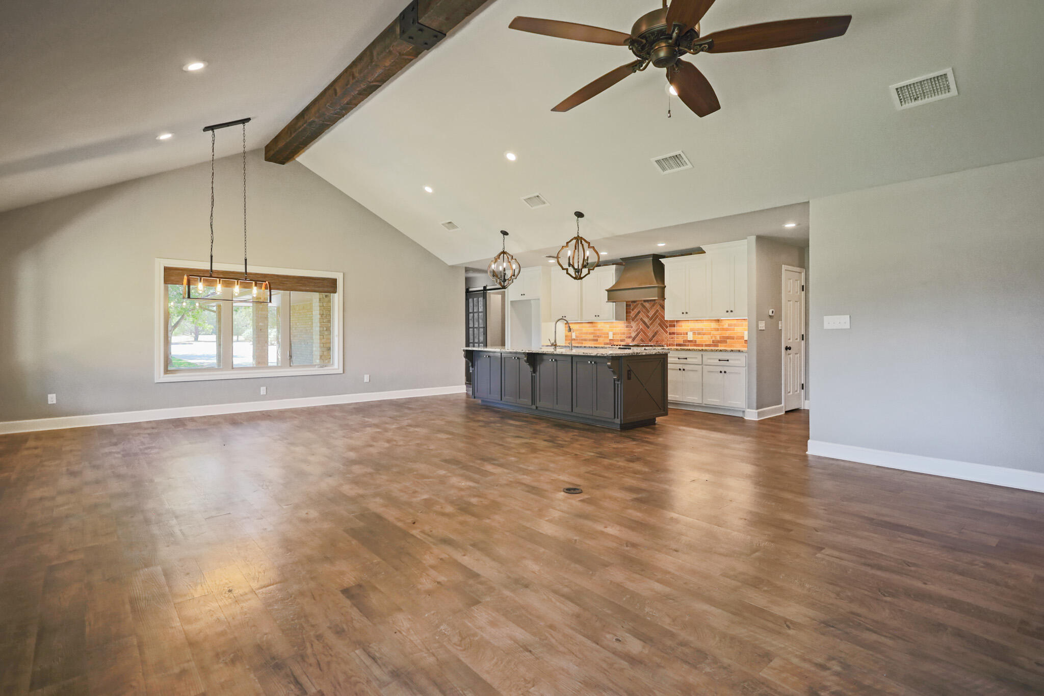 7002 50th Street Lubbock, TX 79407 - Photo 54 of 81 a view of empty room with wooden floor and window
