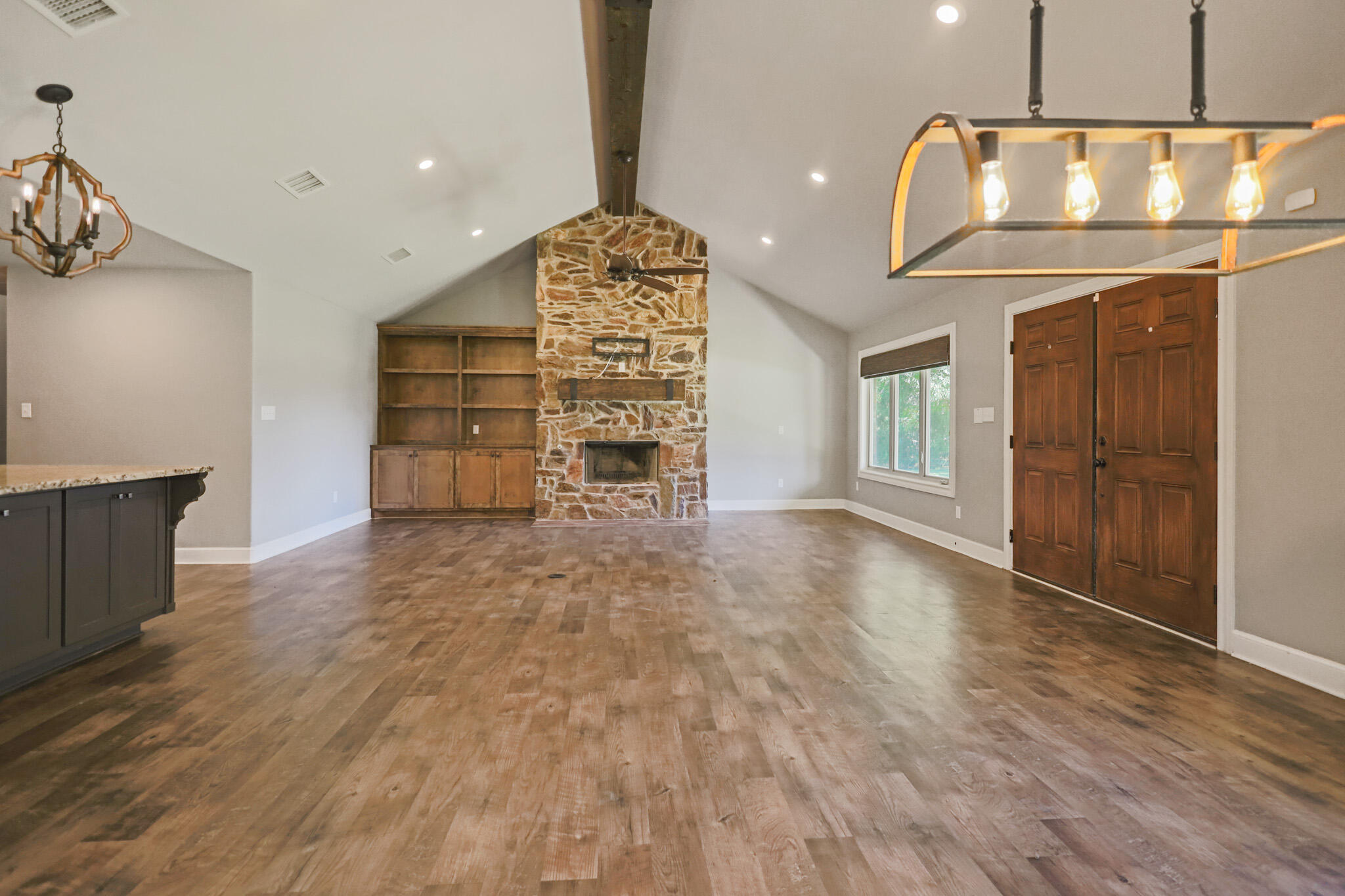 7002 50th Street Lubbock, TX 79407 - Photo 55 of 81 wooden floor in an empty room with a fireplace
