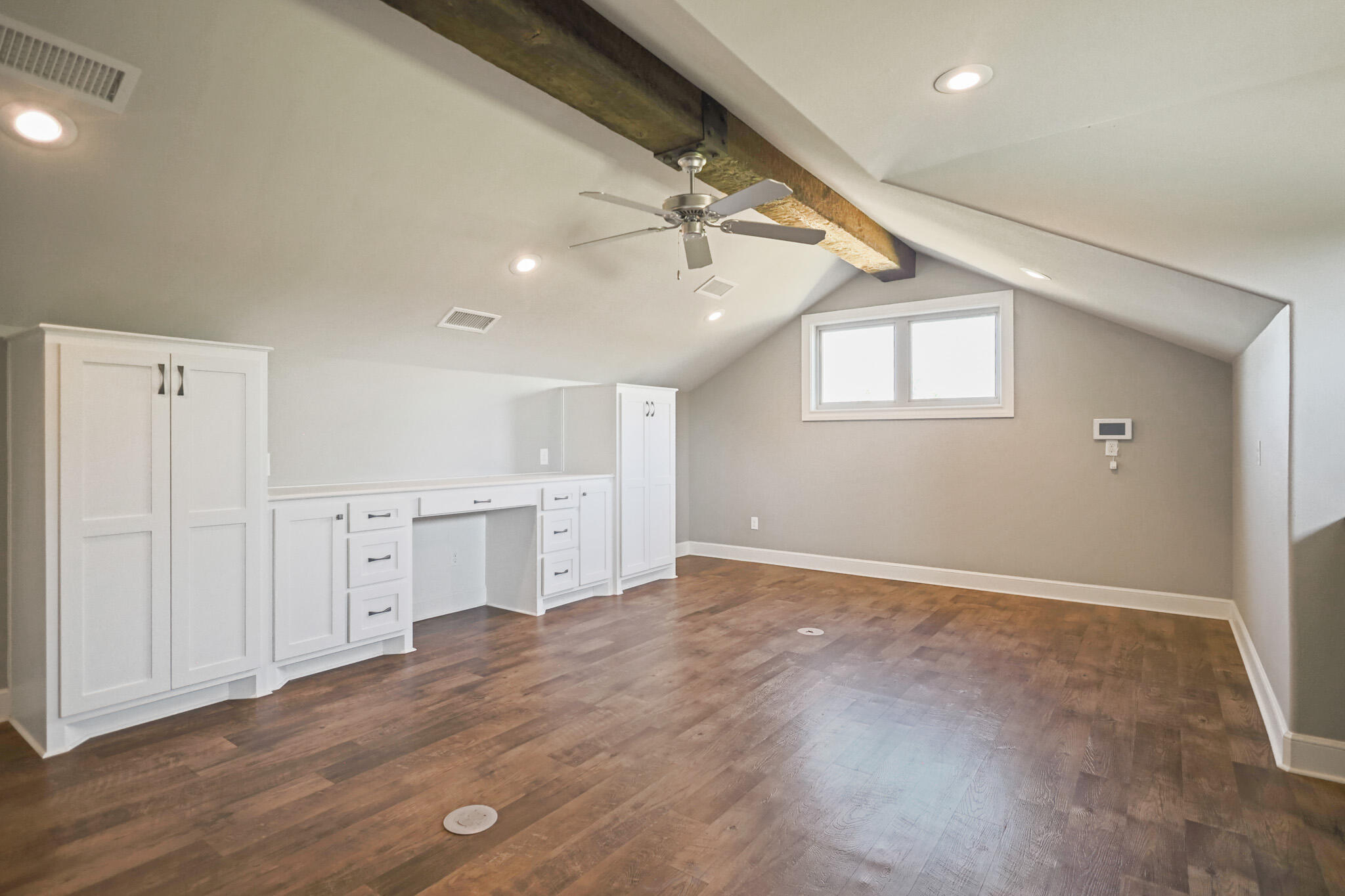 7002 50th Street Lubbock, TX 79407 - Photo 70 of 81 an empty room with windows and cabinet