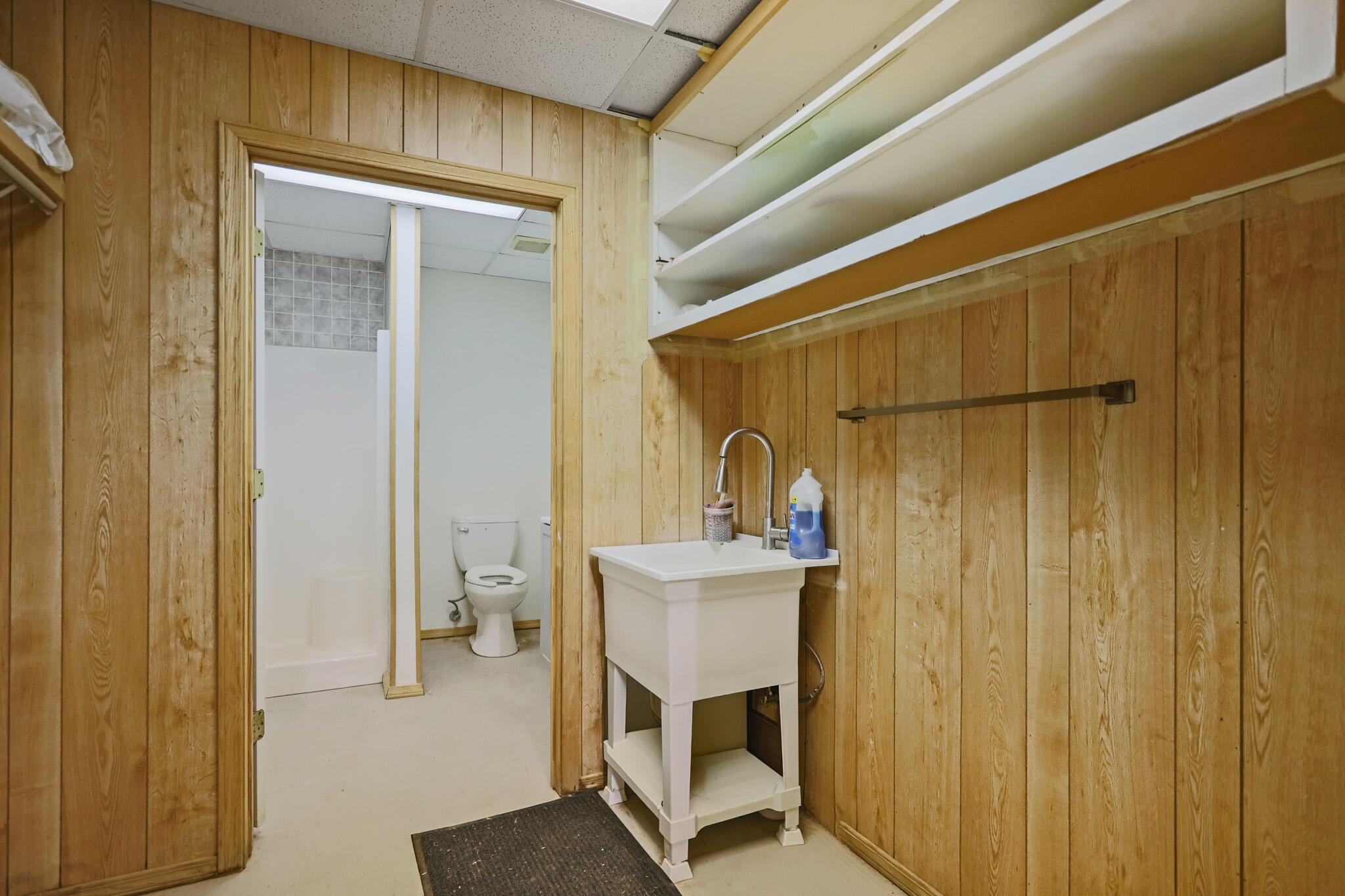 7002 50th Street Lubbock, TX 79407 - Photo 80 of 81 a bathroom with a sink and a mirror