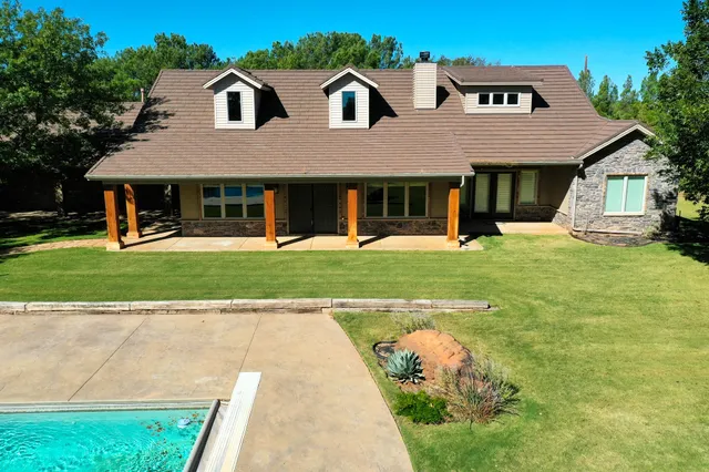 a view of a backyard of the house