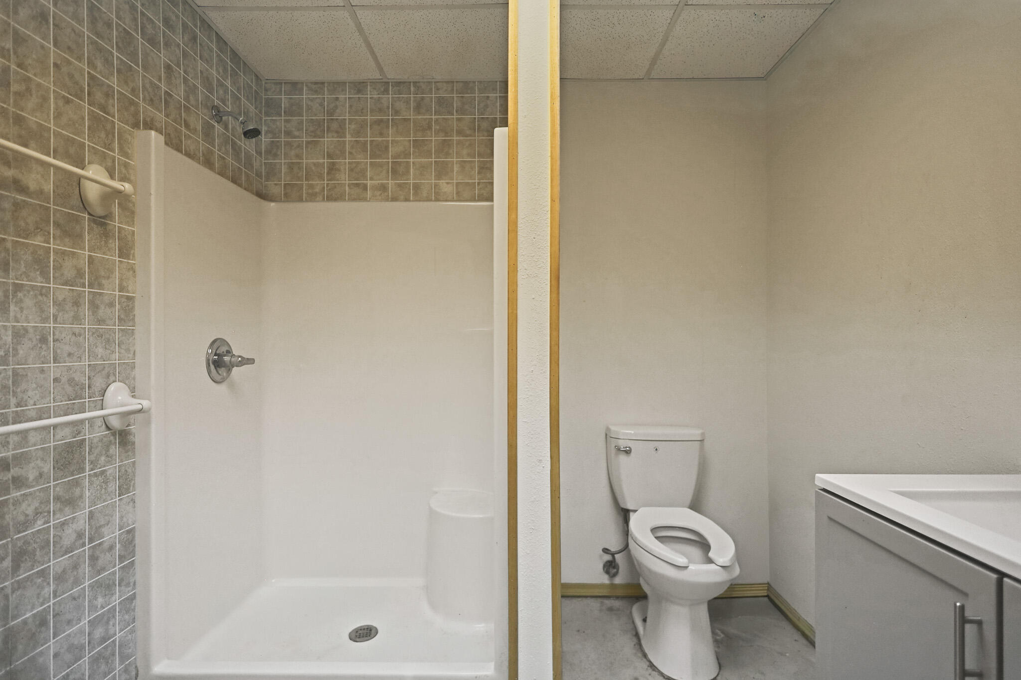 7002 50th Street Lubbock, TX 79407 - Photo 81 of 81 a white toilet sitting next to a bath tub and a shower