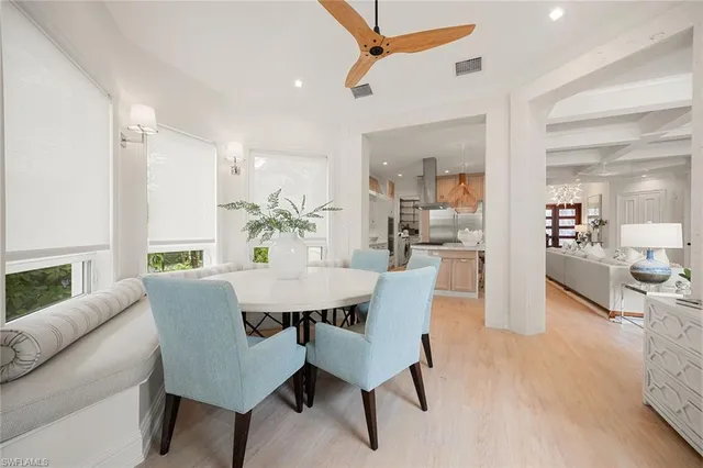 a view of a dining room with furniture and a table