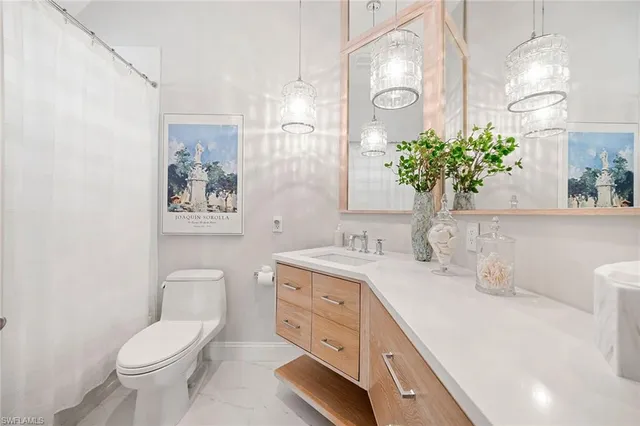 a spacious bedroom with a bed and a window