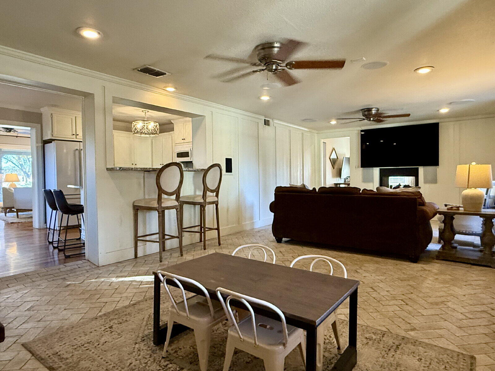 3001 32nd Street Lubbock, TX 79410 - Photo 13 of 35 a living room with furniture and a flat screen tv