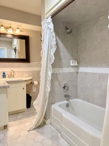 a bathroom with a sink a toilet and a bathtub