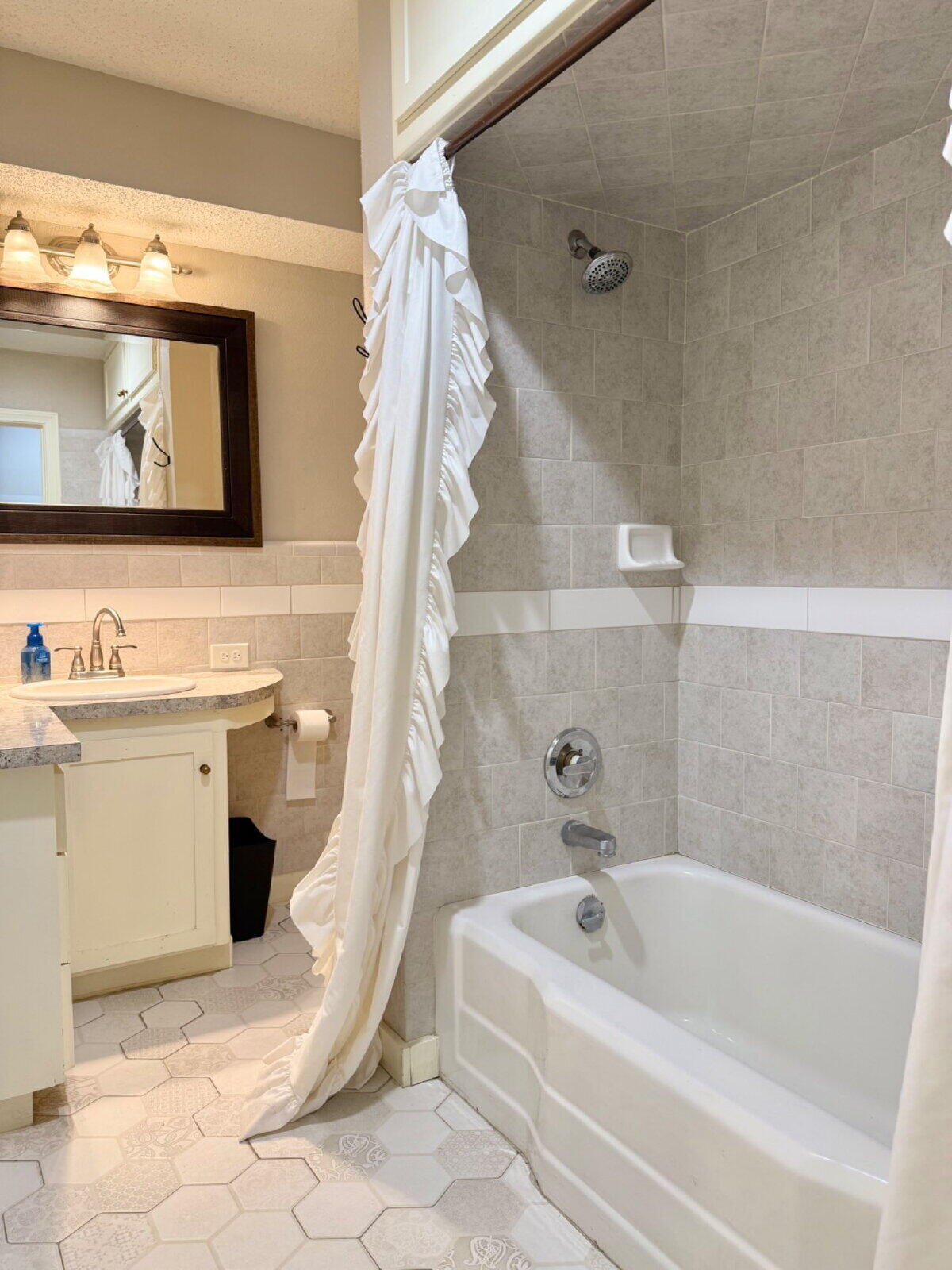 3001 32nd Street Lubbock, TX 79410 - Photo 29 of 35 a bathroom with a sink a toilet and a bathtub