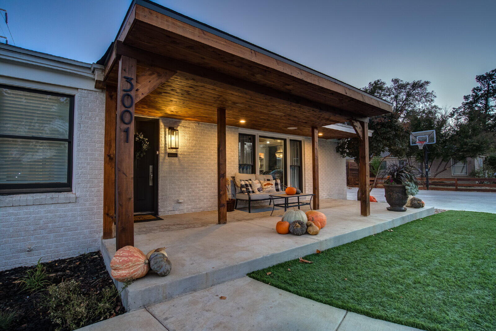 3001 32nd Street Lubbock, TX 79410 - Photo 6 of 35 a group of people sitting in front of a house