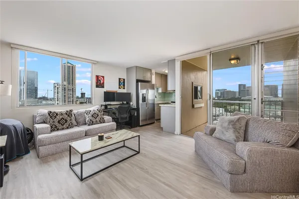 a living room with furniture and a large window