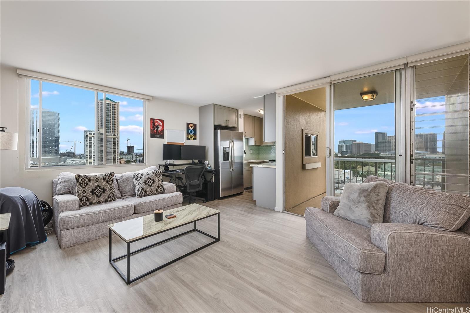 a living room with furniture and a large window
