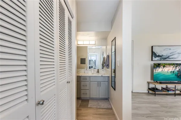 a view of a living room kitchen and a window