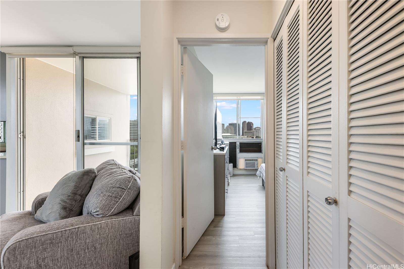 785 Kinau Street, Unit PH4 Honolulu, HI 96813 - Photo 15 of 23 a living room with furniture and a gate