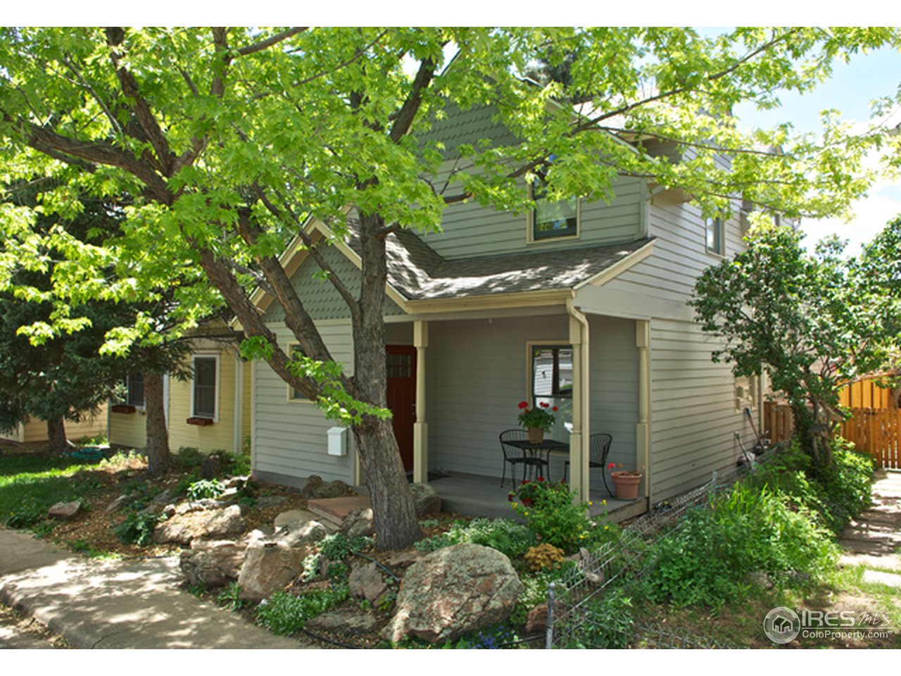 a view of a house with a tree