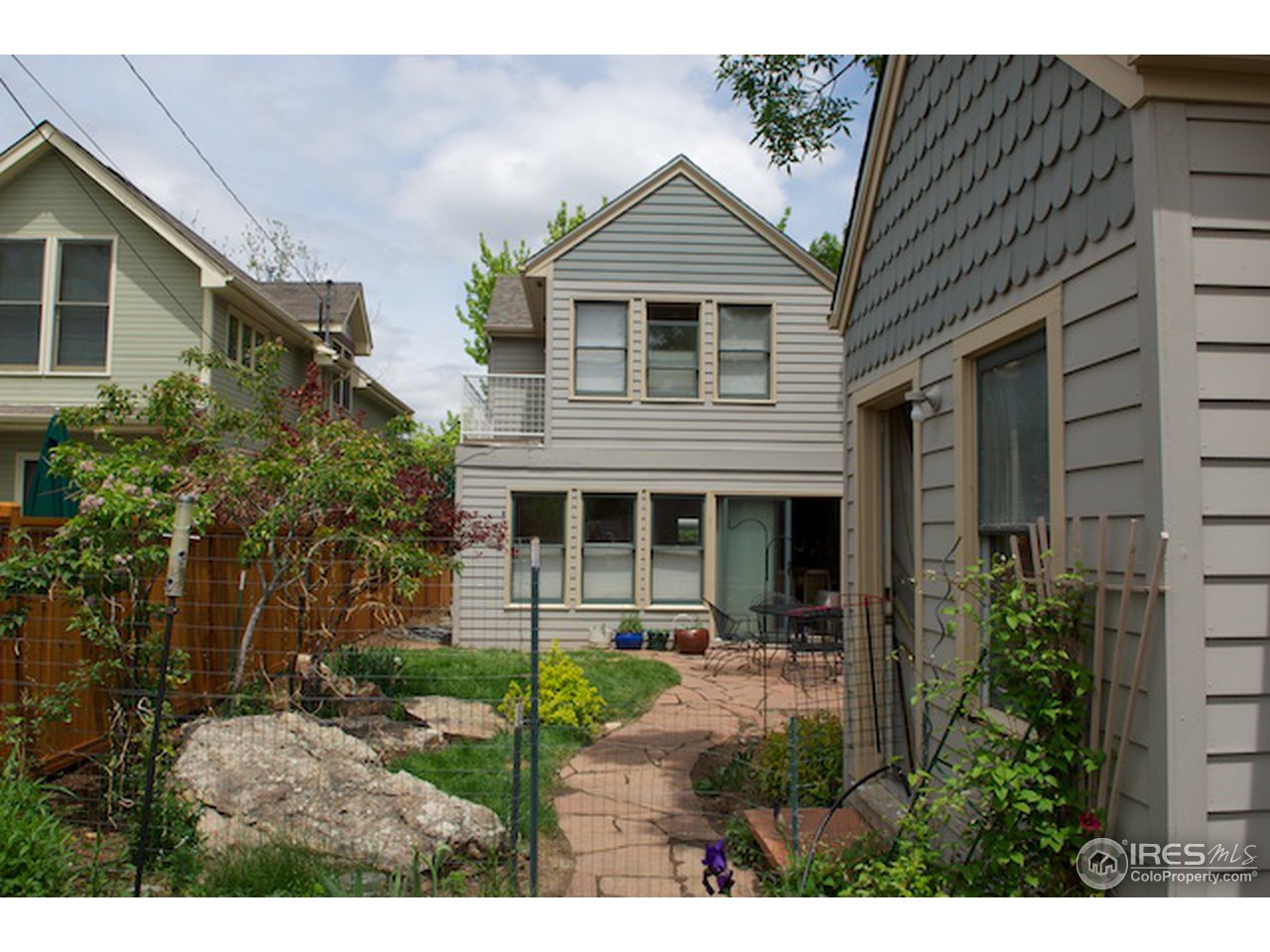 644 Dewey Avenue Boulder, CO 80304 - Photo 11 of 14 a view of a house with brick walls and potted plants