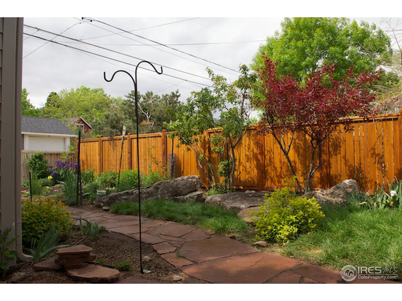644 Dewey Avenue Boulder, CO 80304 - Photo 13 of 14 a view of a garden with a bench