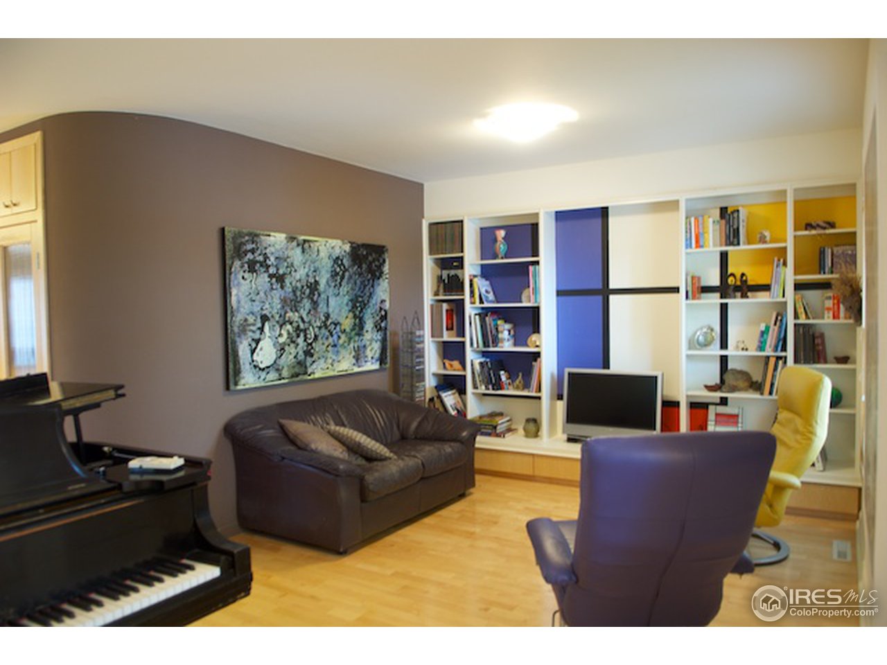 644 Dewey Avenue Boulder, CO 80304 - Photo 2 of 14 a living room with furniture and a flat screen tv