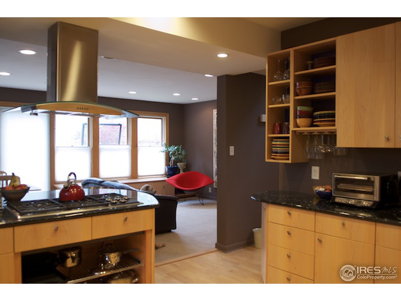 644 Dewey Avenue Boulder, CO 80304 - Photo 5 of 14 a kitchen with stainless steel appliances kitchen island granite countertop a sink and cabinets