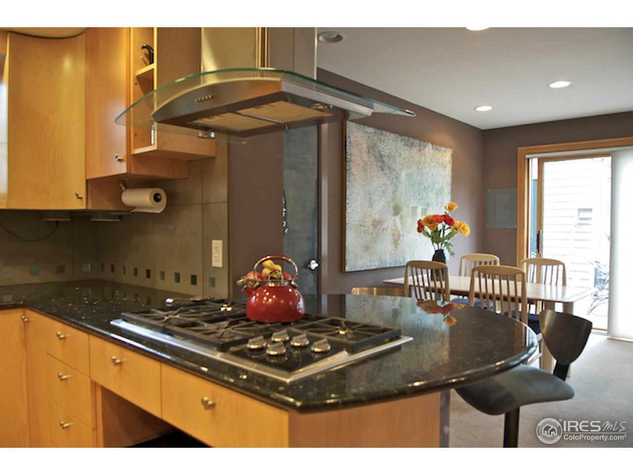 644 Dewey Avenue Boulder, CO 80304 - Photo 6 of 14 a kitchen with a stove and a dining table