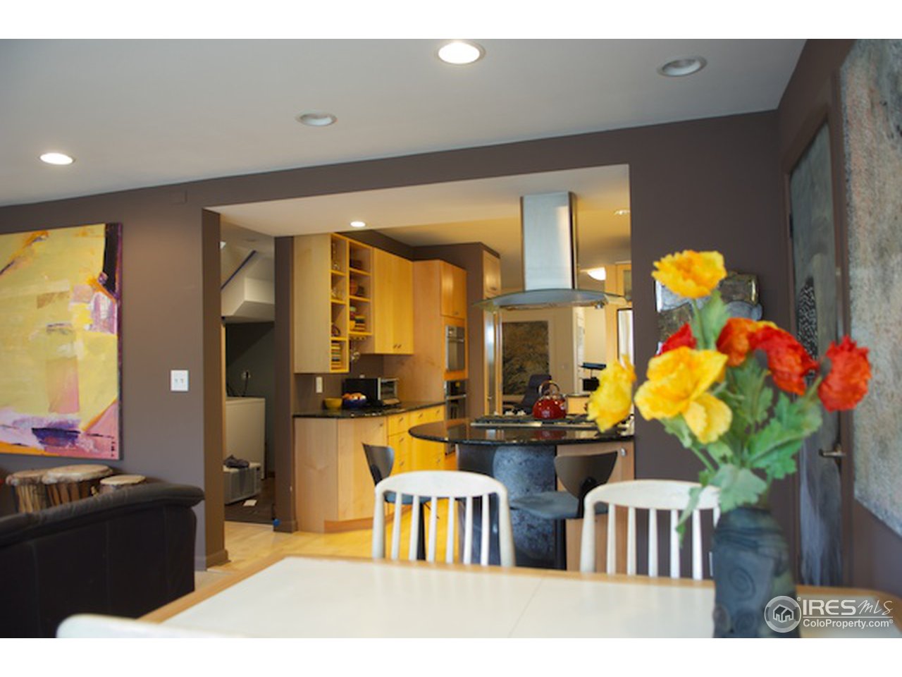 644 Dewey Avenue Boulder, CO 80304 - Photo 8 of 14 a living room with furniture a chandelier and a large window
