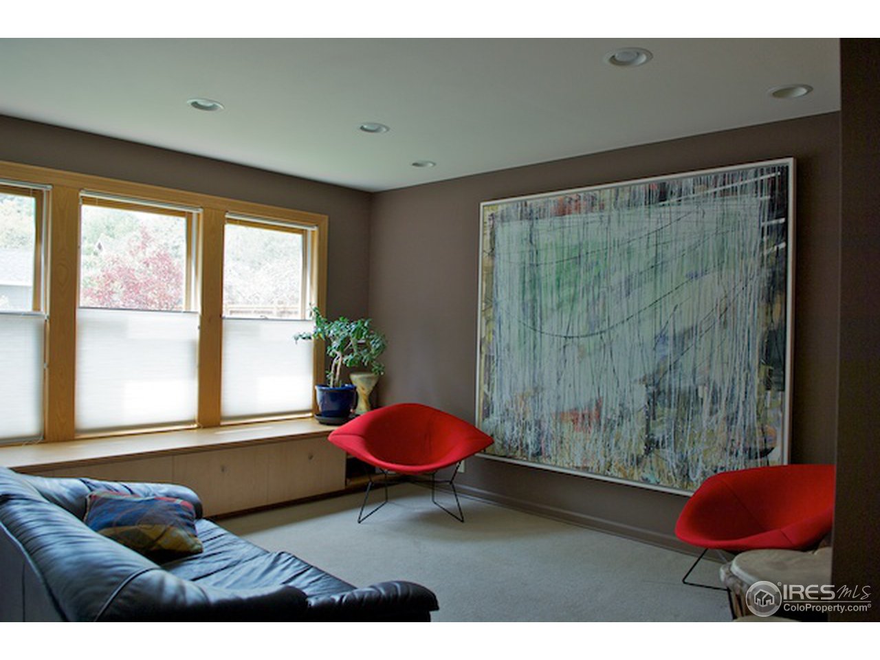 644 Dewey Avenue Boulder, CO 80304 - Photo 9 of 14 a living room with a couch and a table