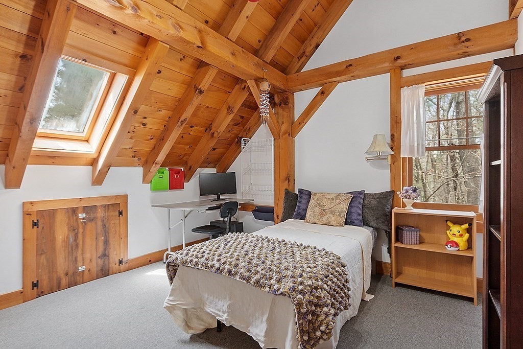 149 Walker Pond Road Sturbridge, MA 01566 - Photo 19 of 42 a bedroom with a bed and a window