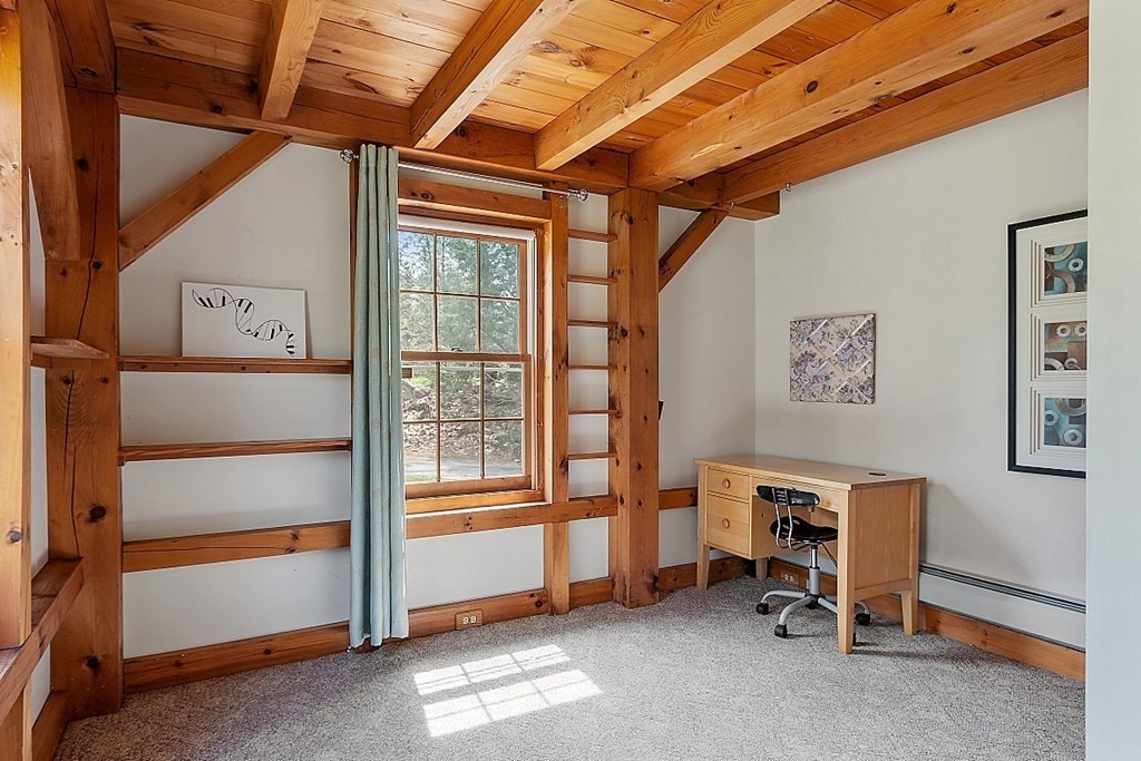 149 Walker Pond Road Sturbridge, MA 01566 - Photo 21 of 42 a view of a livingroom with fridge and workspace