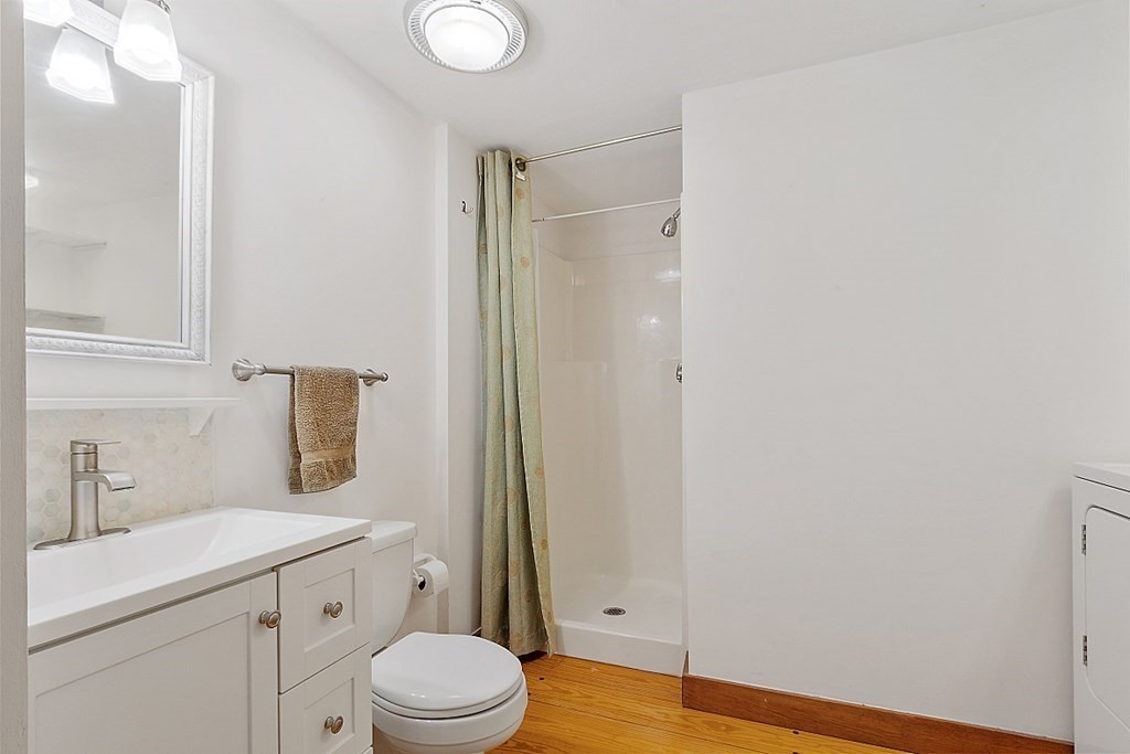 149 Walker Pond Road Sturbridge, MA 01566 - Photo 24 of 42 a bathroom with a sink a toilet and shower