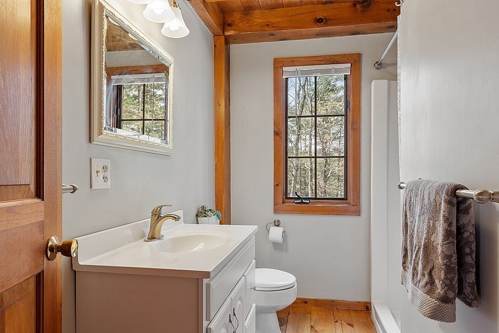 149 Walker Pond Road Sturbridge, MA 01566 - Photo 25 of 42 a bathroom with a sink toilet and a mirror