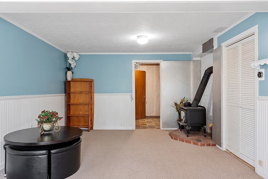 149 Walker Pond Road Sturbridge, MA 01566 - Photo 26 of 42 a living room with furniture and a potted plant
