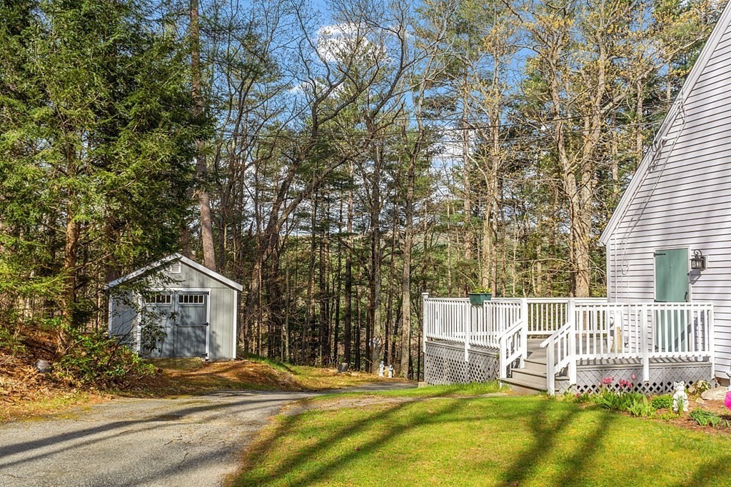 149 Walker Pond Road Sturbridge, MA 01566 - Photo 29 of 42 a house with a trees in front of it