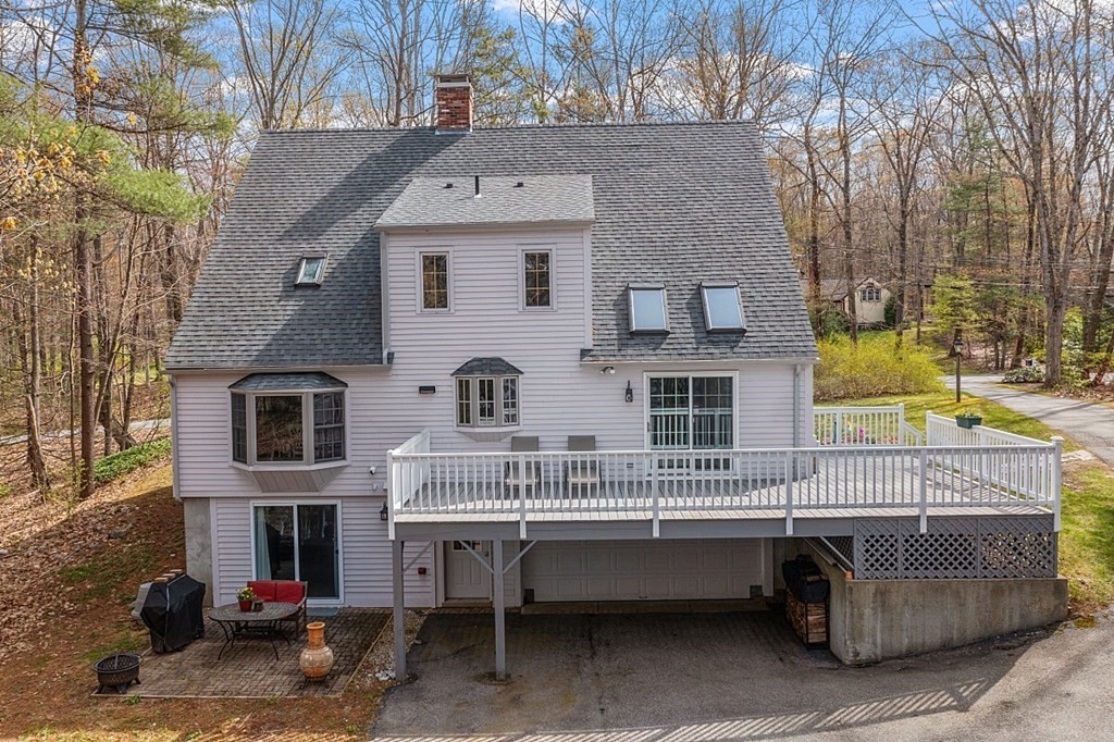 149 Walker Pond Road Sturbridge, MA 01566 - Photo 31 of 42 a view of residential house with outdoor seating space and wooden deck