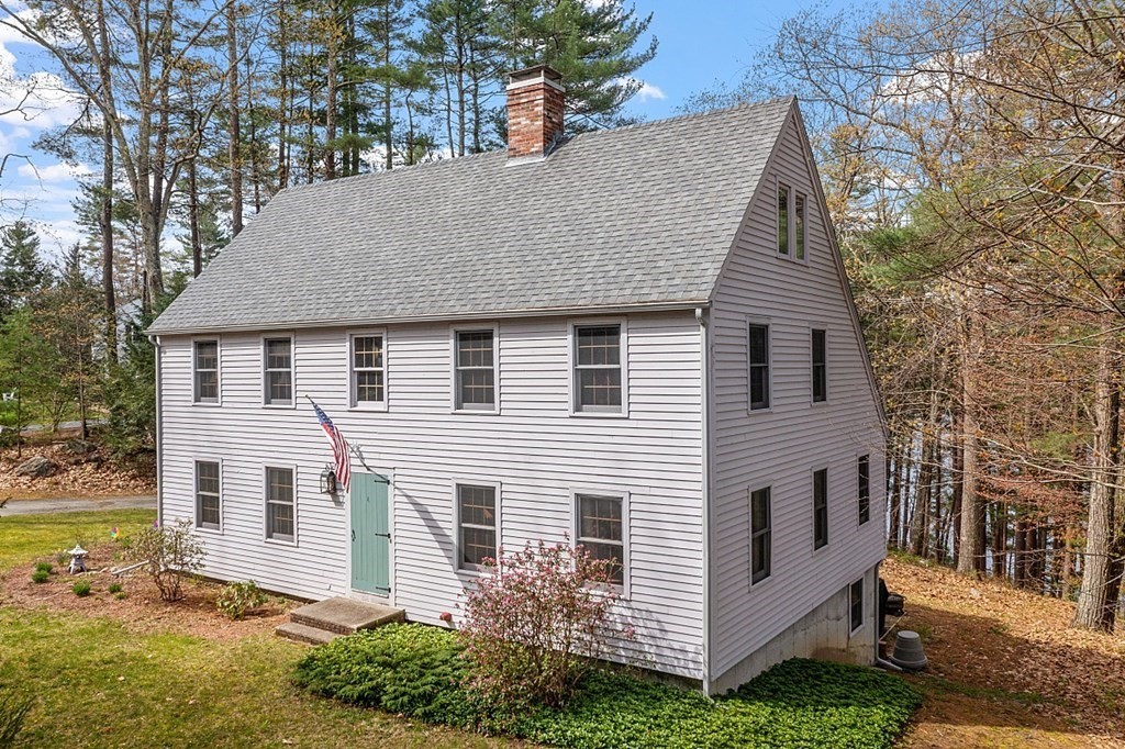 149 Walker Pond Road Sturbridge, MA 01566 - Photo 39 of 42 a aerial view of a house next to a yard