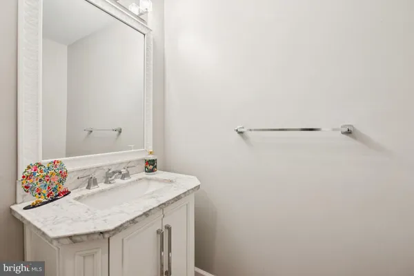 a kitchen with stainless steel appliances granite countertop a sink and dishwasher a stove top oven with wooden floor